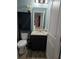 Bathroom featuring modern vanity with granite, toilet, and wood-look flooring at 3811 Island Green Way, Orlando, FL 32824