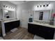 Dual sink bathroom with granite countertops, stylish mirrors, and plenty of space at 3811 Island Green Way, Orlando, FL 32824