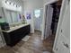 Bathroom with vanity, sink and an open door to a storage closet with shelving at 3811 Island Green Way, Orlando, FL 32824