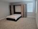 Bedroom featuring a murphy bed, light gray walls and carpeted floors at 3811 Island Green Way, Orlando, FL 32824