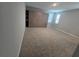 Spacious bedroom with carpet floors featuring a murphy bed and built in shelving unit at 3811 Island Green Way, Orlando, FL 32824