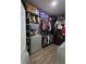 Walk-in closet with organized shelving and storage for clothes, boxes, and towels at 3811 Island Green Way, Orlando, FL 32824