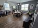 Open dining area with wood-look flooring, lots of natural light, and dining table with decor at 3811 Island Green Way, Orlando, FL 32824