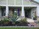 Inviting home with manicured landscaping, stone accents, and a brick walkway to the front door at 3811 Island Green Way, Orlando, FL 32824