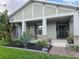 Charming home with a well-manicured front yard with lush landscaping and stone accents at 3811 Island Green Way, Orlando, FL 32824