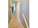 Hallway with gray walls and beige carpet leading to a bedroom with natural light at 3811 Island Green Way, Orlando, FL 32824
