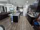 Bright, open kitchen featuring an island with seating, stainless appliances, and dark cabinetry at 3811 Island Green Way, Orlando, FL 32824
