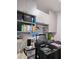Laundry area features modern appliances, cabinets, storage baskets, and a rod for hanging clothes at 3811 Island Green Way, Orlando, FL 32824