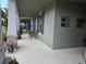 Covered porch with seating area, decorative plants, and neutral exterior paint at 3811 Island Green Way, Orlando, FL 32824