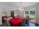 Formal dining room with hardwood floors and a view to the living room at 4034 Winderlakes Dr, Orlando, FL 32835