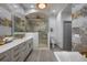 Spa-like bathroom featuring a large walk-in shower and double vanity at 465 Songbird Way, Apopka, FL 32712