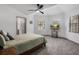 Relaxing main bedroom with a king-size bed and large windows at 465 Songbird Way, Apopka, FL 32712