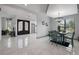 Dining area with marble floors, chandelier, and view of the entry at 465 Songbird Way, Apopka, FL 32712