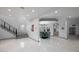Open dining area with marble floors and a view of the entry at 465 Songbird Way, Apopka, FL 32712