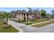 Charming two-story brick home with manicured lawn and welcoming curb appeal at 465 Songbird Way, Apopka, FL 32712