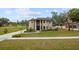 Two-story house with brick exterior, landscaping, and driveway at 465 Songbird Way, Apopka, FL 32712