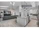 Gourmet kitchen features granite countertops and an eat-in island at 465 Songbird Way, Apopka, FL 32712