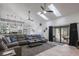 Open living space with comfortable sectional sofa and view into kitchen at 465 Songbird Way, Apopka, FL 32712