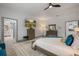 Bright bedroom with ensuite bathroom and large dresser at 465 Songbird Way, Apopka, FL 32712