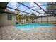 Inviting screened pool with tiled deck at 465 Songbird Way, Apopka, FL 32712