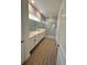 Elegant bathroom featuring double vanity and walk-in shower at 5015 Dancy Ln, Saint Cloud, FL 34772