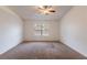 Spacious bedroom with carpeted floor and large window at 5160 Wood Ridge Ct, Ocoee, FL 34761