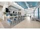 Modern lounge area featuring a sleek bar with comfortable seating and contemporary design at 7770 Sandy Ridge Dr # 114, Reunion, FL 34747