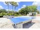 Outdoor ping pong tables surrounded by lush landscaping providing a fun and active recreation area at 7770 Sandy Ridge Dr # 114, Reunion, FL 34747