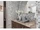 Modern bathroom vanity with mosaic tile and granite countertop at 155 S Court Ave # 2908, Orlando, FL 32801