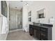 Modern bathroom with a large shower, dark vanity, and city view at 155 S Court Ave # 2908, Orlando, FL 32801