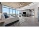 Luxurious main bedroom with city views and large windows at 155 S Court Ave # 2908, Orlando, FL 32801