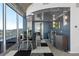 Modern dining area with glass table and chairs, adjacent to a wet bar at 155 S Court Ave # 2908, Orlando, FL 32801