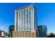 High rise building exterior in a city setting with blue skies at 155 S Court Ave # 2908, Orlando, FL 32801