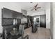 Modern kitchen with dark cabinetry, island, and breakfast bar at 155 S Court Ave # 2908, Orlando, FL 32801