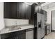 Modern kitchen with stainless steel appliances and granite countertops at 155 S Court Ave # 2908, Orlando, FL 32801