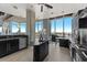 Modern kitchen with island, stainless steel appliances, and city views at 155 S Court Ave # 2908, Orlando, FL 32801