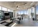 Open living area with floor-to-ceiling windows showcasing stunning city views at 155 S Court Ave # 2908, Orlando, FL 32801