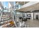 Modern floating staircase with glass and metal railings at 155 S Court Ave # 2908, Orlando, FL 32801