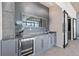 Modern wet bar with wine cooler and granite countertop at 155 S Court Ave # 2908, Orlando, FL 32801