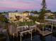 Stunning waterfront home features a private dock, pool, outdoor kitchen, and lush landscaping at 25 Cunningham Dr, New Smyrna Beach, FL 32168