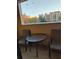 Private balcony with small table and chairs at 12521 Floridays Resort Dr # 207F, Orlando, FL 32821