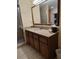 Bathroom with granite vanity and large mirror at 12521 Floridays Resort Dr # 207F, Orlando, FL 32821