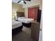 Guest bedroom with two twin beds, nightstands, and a TV at 12521 Floridays Resort Dr # 207F, Orlando, FL 32821