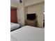 Bedroom with two beds and a dresser at 12521 Floridays Resort Dr # 207F, Orlando, FL 32821