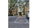 Building exterior with parking and landscaping at 12521 Floridays Resort Dr # 207F, Orlando, FL 32821