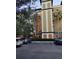 Building exterior with parking and landscaping at 12521 Floridays Resort Dr # 207F, Orlando, FL 32821