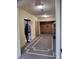 Building hallway with elevator and security guard at 12521 Floridays Resort Dr # 207F, Orlando, FL 32821