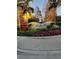 Community entrance sign with landscaping and palm trees at 12521 Floridays Resort Dr # 207F, Orlando, FL 32821