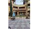 Relaxing courtyard with table and chairs at 12521 Floridays Resort Dr # 207F, Orlando, FL 32821