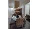 Dining area with glass table and seating for four at 12521 Floridays Resort Dr # 207F, Orlando, FL 32821